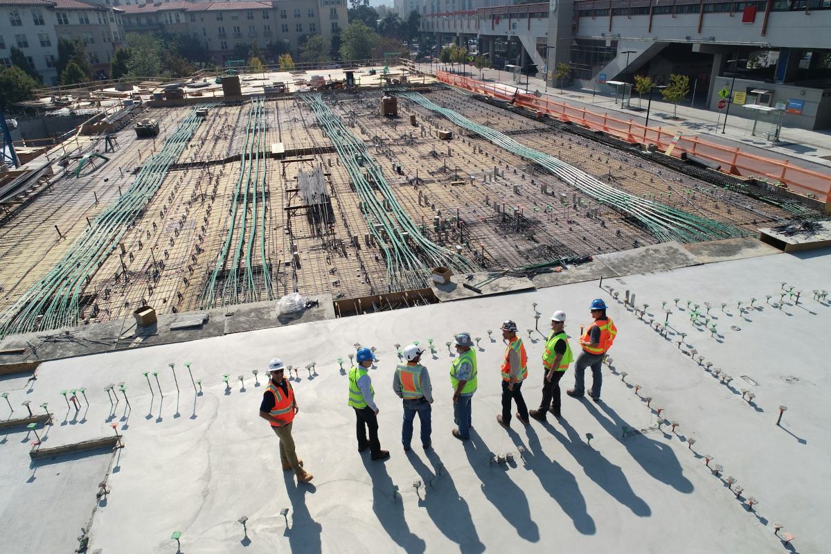 Workers on a reinforced foundation slab under construction