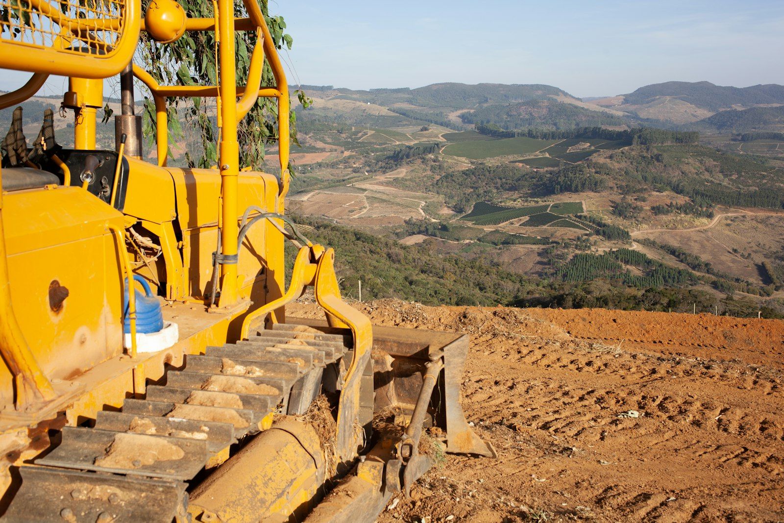 Earthworks machinery on a hillside development site